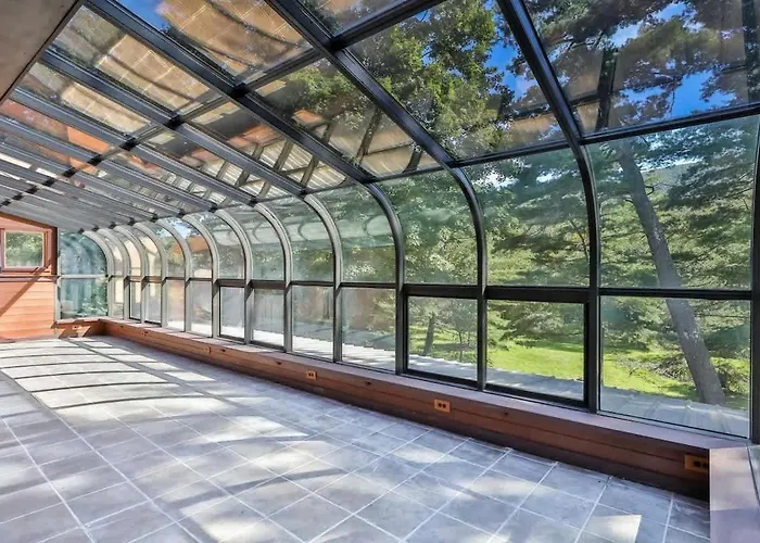 Stream-Side Atrium Home With Side Rooms & Pool Table