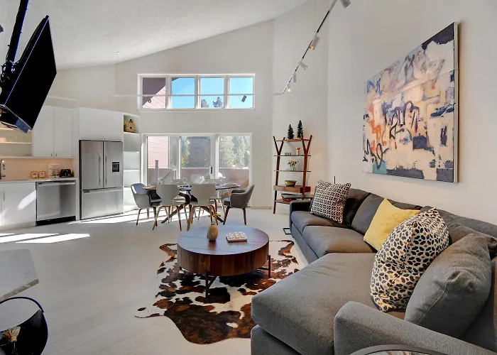Riverfront Ski Retreat: Luxury Condo with Hot Tub & Activity Perks