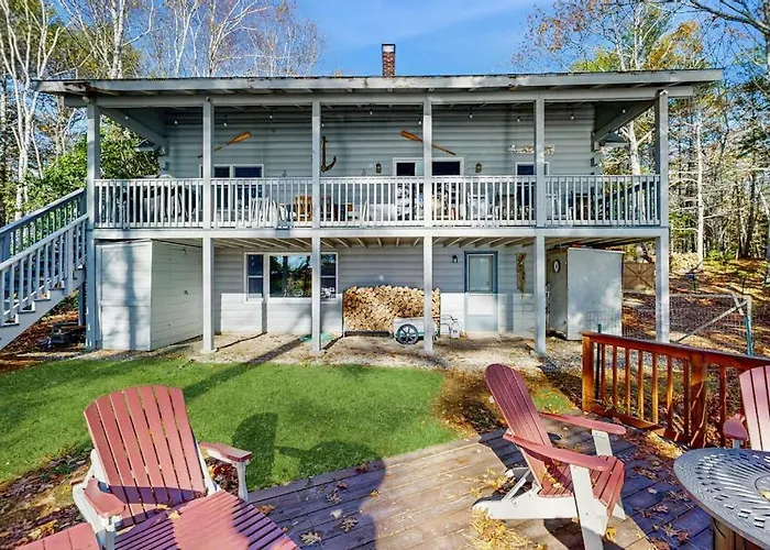 Charming Riverfront Home With Cozy Interiors, Dock, And Scenic Deck Views
