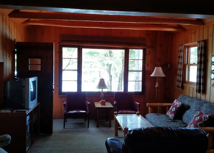 Log Cottage On Blue Lake